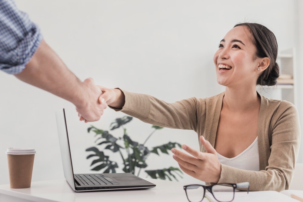 happy woman receiving feedback at her new job for her good performance