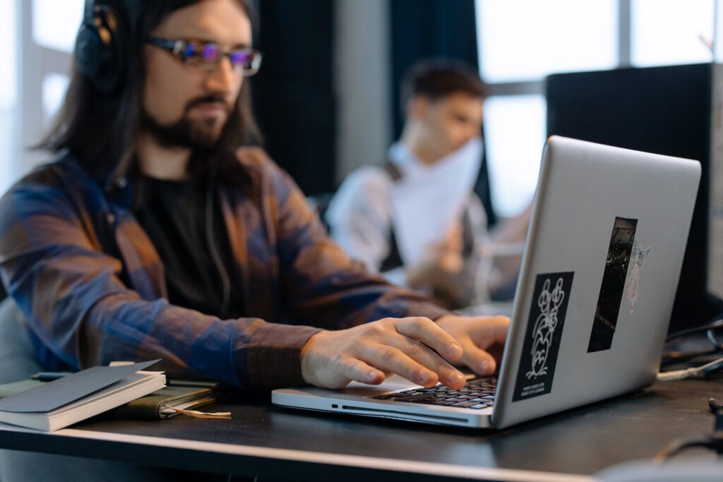 Tech lead working with his laptop in the office