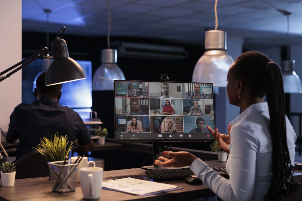 Businesswoman chatting remotely with her distributed teams