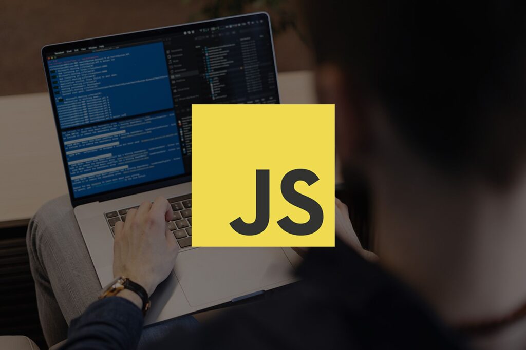 Javascript files logo on top of a developer working at the office